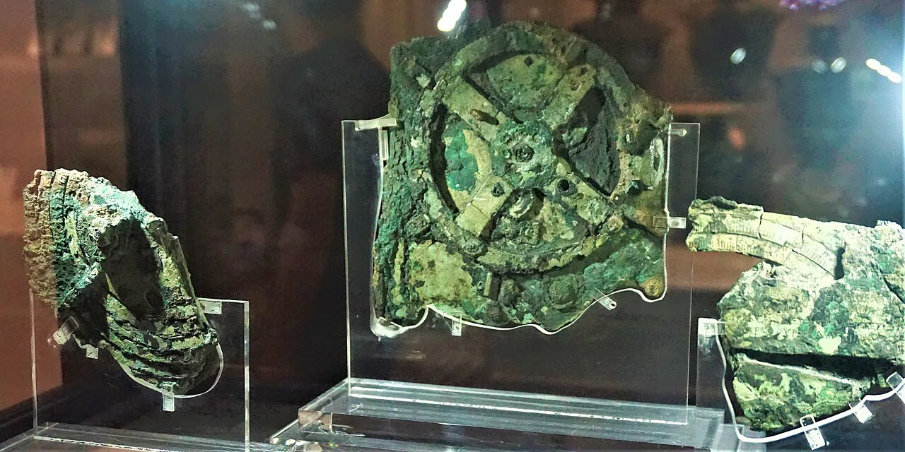 Surviving corroded fragments of the Antikythera mechanism displayed in the National Archaeological Museum in Athens