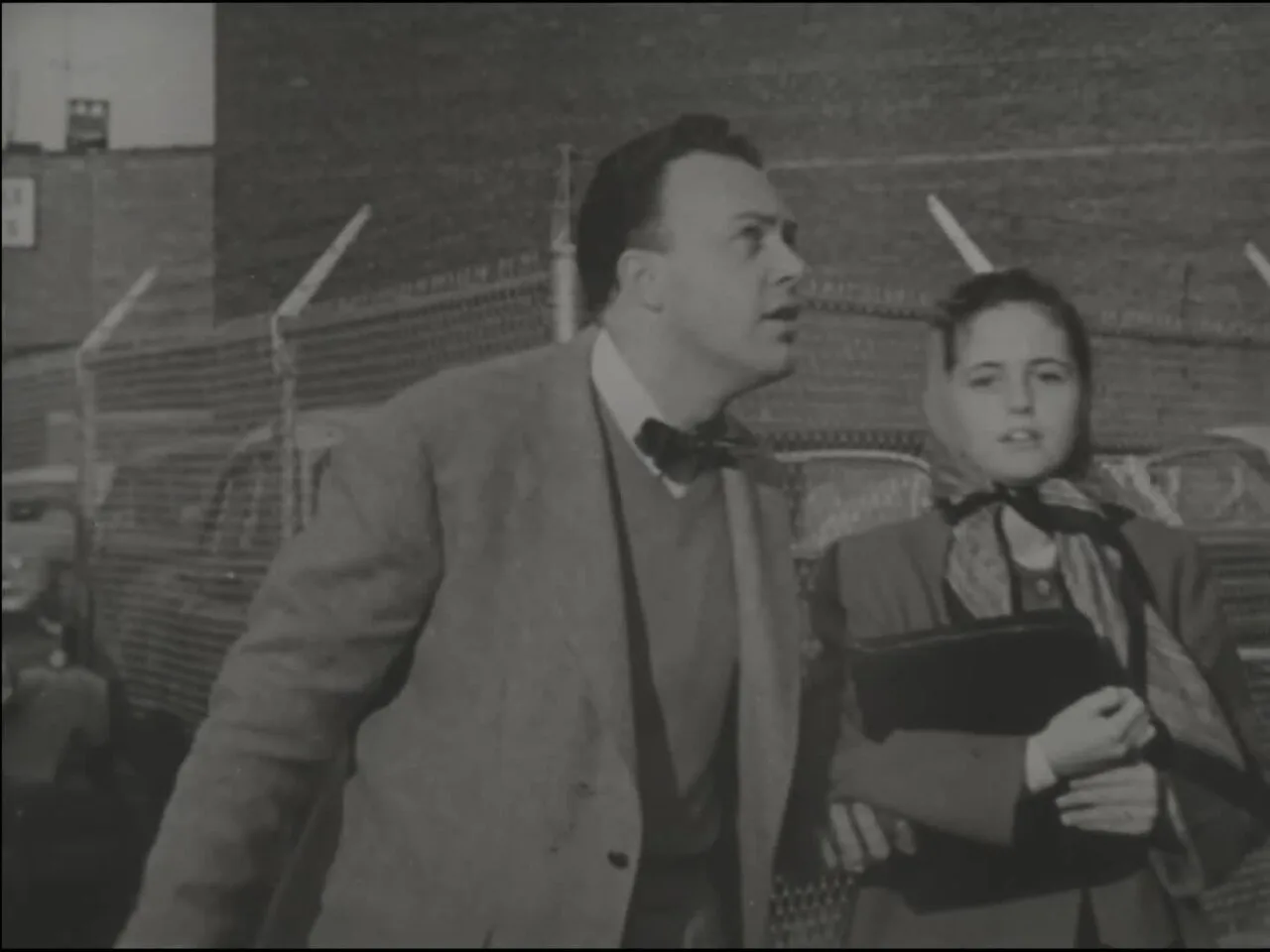 A teacher and a student appearing in the 1951 civil defense film Duck and Cover