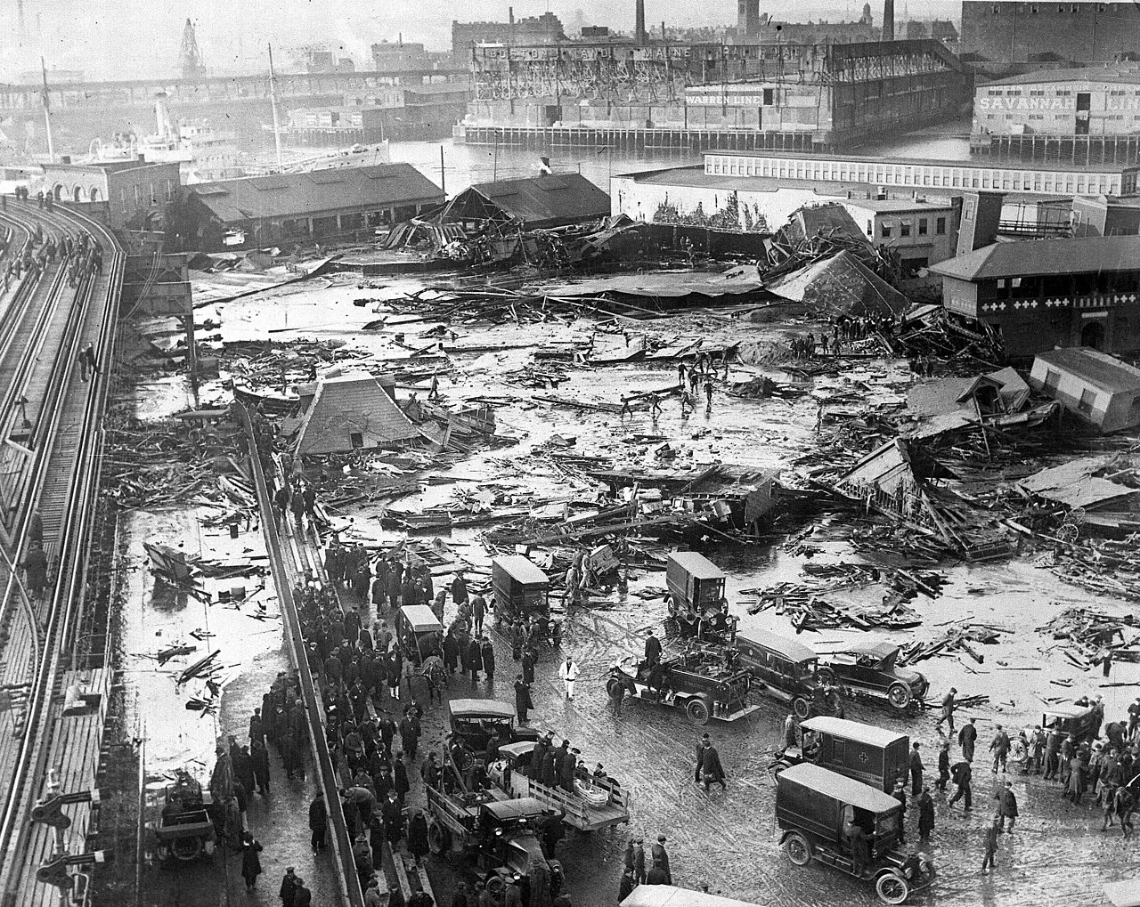 Wide view of wreckage and rescue activity after the 1919 Boston molasses flood