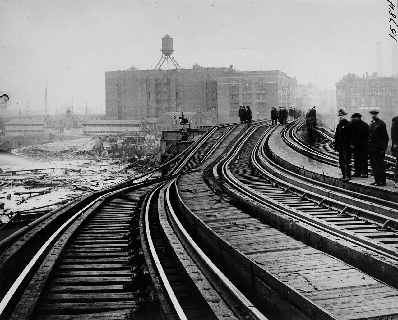 Rail lines, debris, and onlookers in the aftermath of the Boston molasses flood